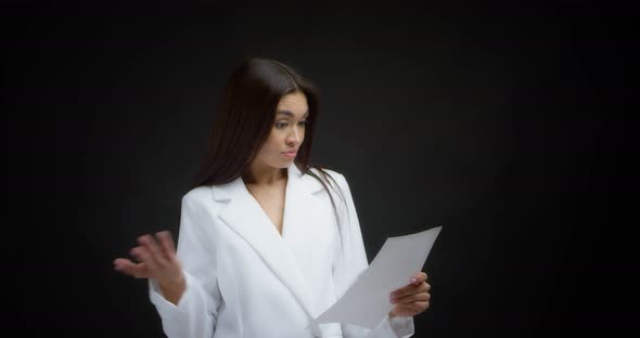 Businesswoman is Dissatisfied and Throws White Pieces of Paper