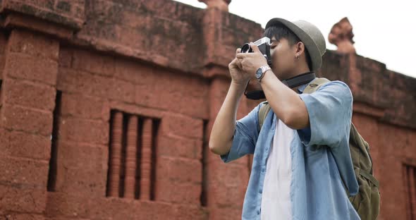 Man takes a photo and visits ancient temple