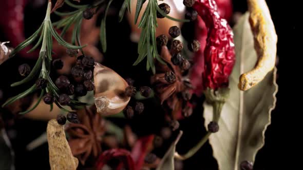 Super Slow Motion Shot of Flying Mix Spices in Black Background