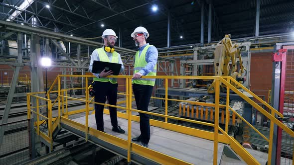 Engineers, Colleagues Work in a Facility at a Brick Factory.