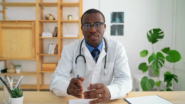 Doctor Sit at Desk and Talk in Video Conference with Patient Spbas