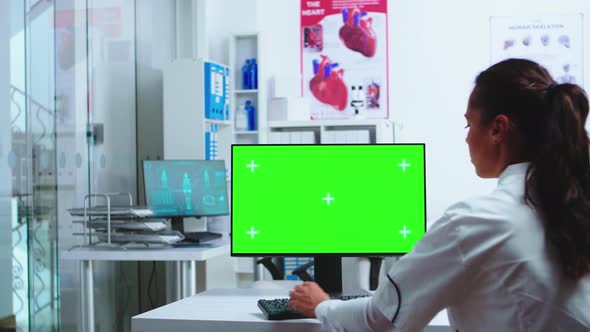 Physician Using Computer with Chroma Key