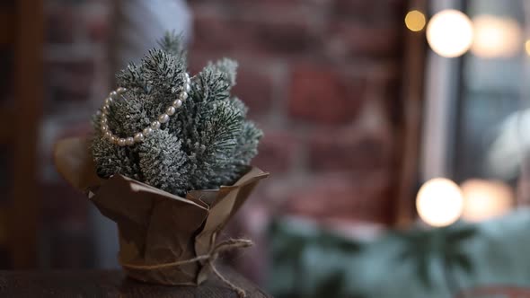 Decorative Christmas Tree Stands on the Table at Home