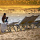 Sun Loungers Near To Sea At Beach Sunset - VideoHive Item for Sale