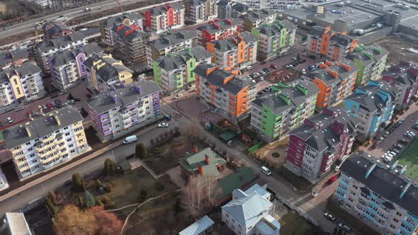 Drone Tilt Reveal Down Shot of Area with Residential Condominium Building in the City