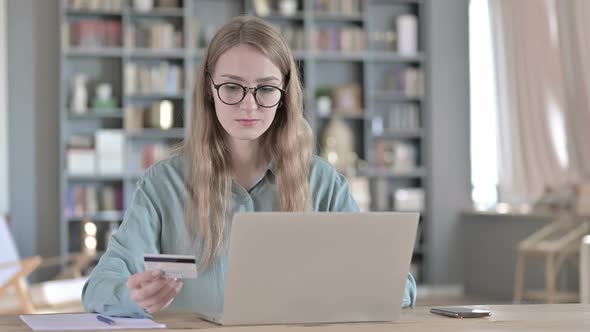 Portrait of Young Woman Making Online Payment By Credit Card