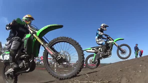 Men racing in a motocross motor sports race.