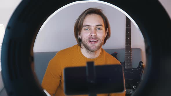 Young Caucasian Man Influencer Recording Video on His Smartphone