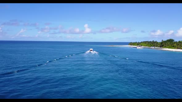 Aerial top down sky of idyllic island beach time by shallow water and white sandy background of a da