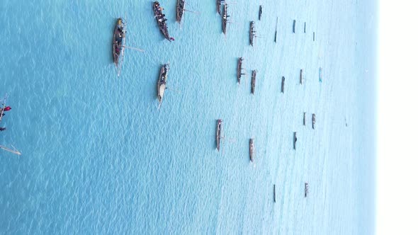 Tanzania Vertical Video  Boat Boats in the Ocean Near the Coast of Zanzibar Aerial View