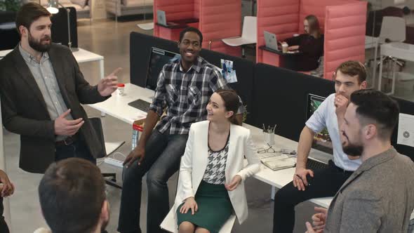 Businesspeople Laughing and Chatting on Lunch Break