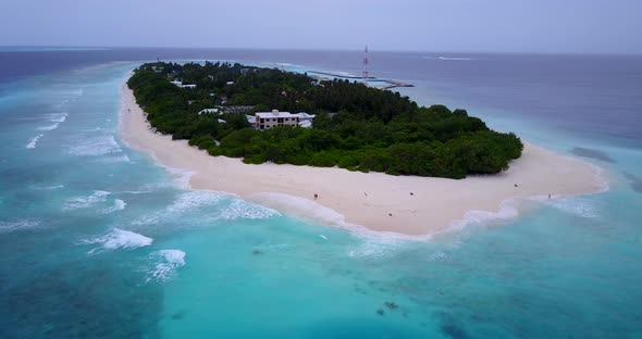 Beautiful overhead travel shot of a paradise sunny white sand beach and turquoise sea background in 