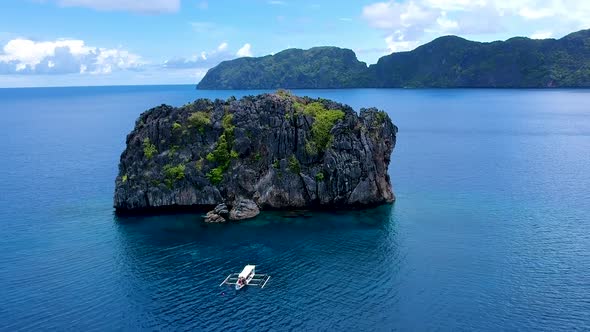 Wide aerial shot of dive boat at North rock dive site, El Nido, Palawan, Philippines