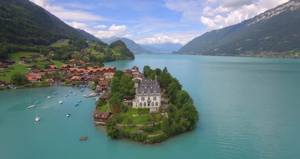 Aerial travel drone view of Iseltwald, Lake Brienz, Switzerland.