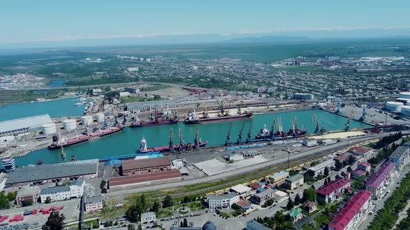 Aerial top view of cargo ship standing in the port