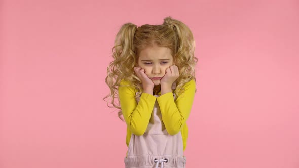Pretty Female Kid with Blond Hair Is Feeling Sick