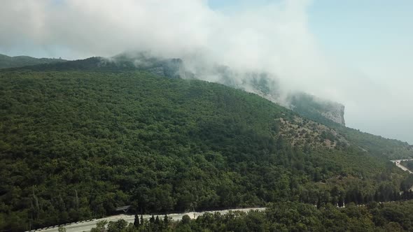 Crimea with Beautiful View of Mountains and Highway Road Between the Mountains. Aerial View Of Fast