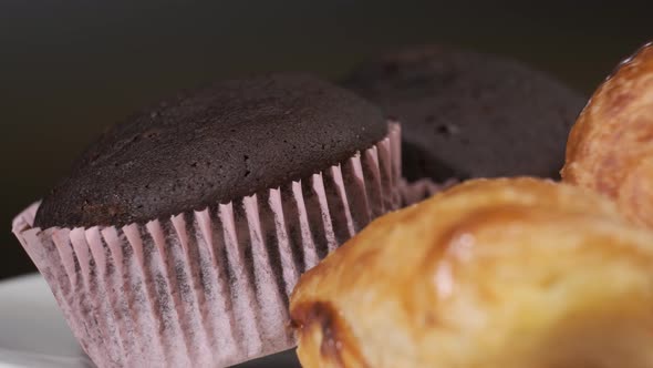 Various types of cakes on white plate rotating in front of camera, Close-up rotates view of Sweets