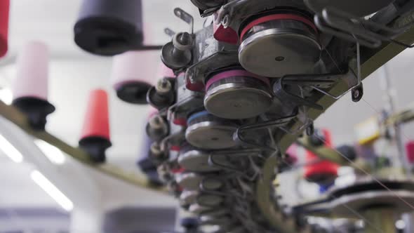 Close-up of circular knitting machine in knitting factory