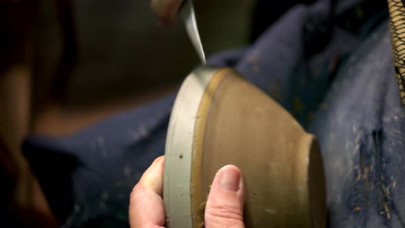 Potter Preparing Clay Bowl for Painting