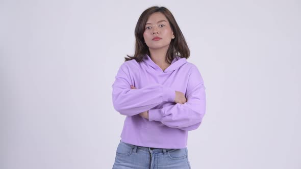 Young Beautiful Asian Woman with Arms Crossed