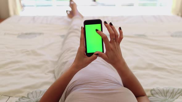 Woman Using Mobile Phone on Bed Alpha Channel alt