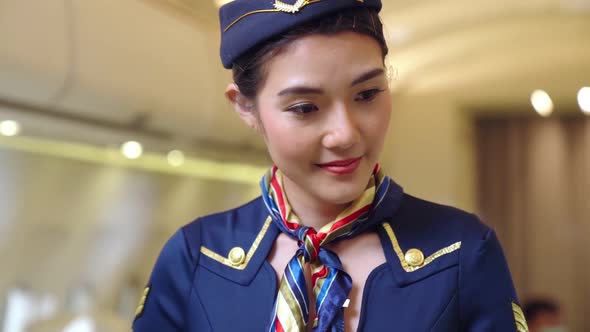 Cabin Crew or Air Hostess Working in Airplane