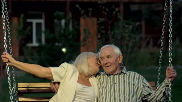 Couple on Porch Swing, Evening.