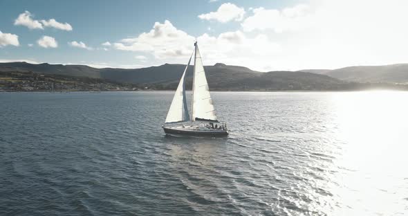 Slow Motion Yacht Racing at Ocean Bay with Highlang Island Coast Aerial