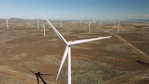 Renewable Energy Wind Farm Aerial View With Turbine Propellers Spinning