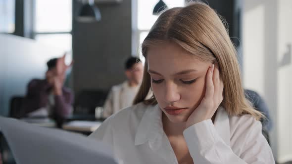 Closeup Young Caucasian Upset Girl Student Sitting Alone in Classroom at Desk Suffering From Abuse