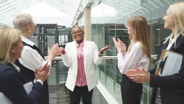 Afro American Woman Get Congratulations By Caucasian Colleagues, Clapping Hands