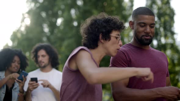 Smiling Multiracial Couple Having Pleasant Conversation 