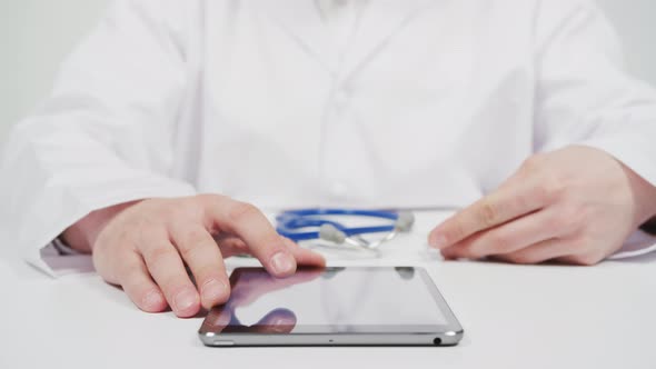 Doctor writing a prescription on tablet