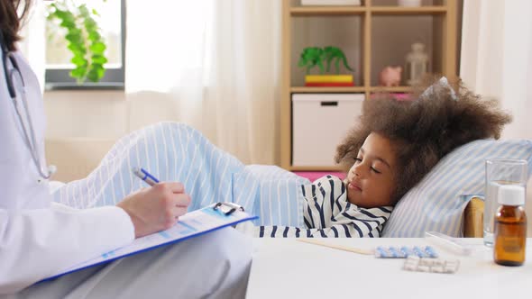 Doctor with Clipboard and Sick Girl in Bed at Home