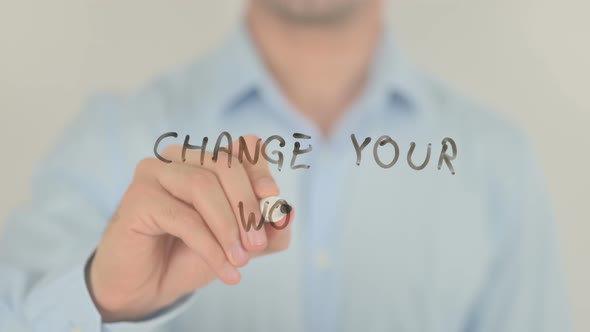 Change Your World, Man Writing on Transparent Screen