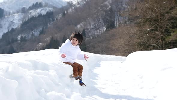 Cute Asian Child Playing Snow Outdoors Slow Motion