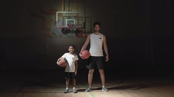 Portrait of Happy Boy and Basketball Player