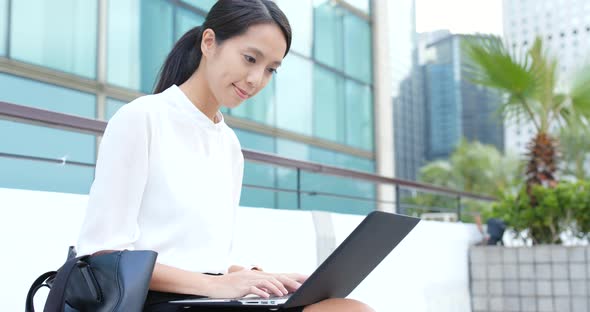 Businesswoman use of laptop computer at outdoor