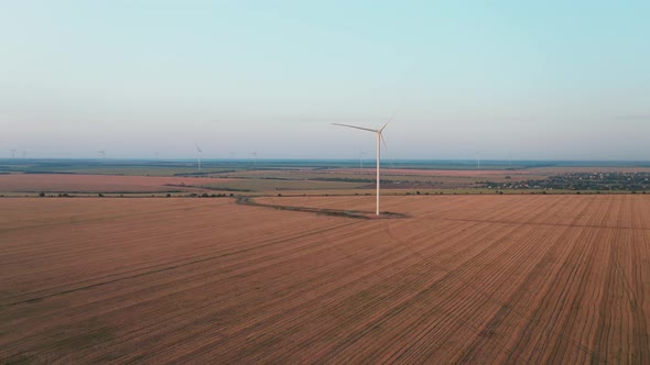 An Aerial Drone Shot of a Wind Farm Producing Renewable Energy