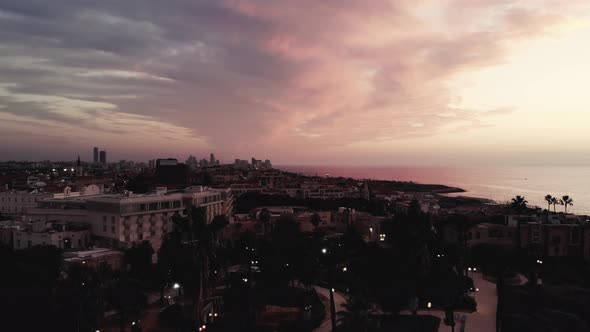 Epic drone shot getting up above old Jaffo at sunset 4K