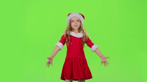 Baby Girl in Red New Year Costume Is Dancing. Green Screen
