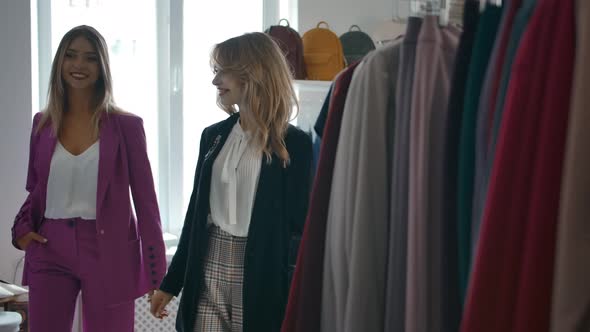 Women Choosing Clothes in Fashion Store