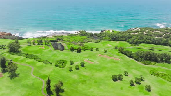 Aerial Footage of People on Scenic Golf Course Playing Sport Match Kauai Hawaii