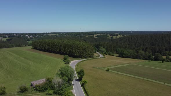 Road in nature reserve Eifel in Germany near Kalterherberg, hills and forest