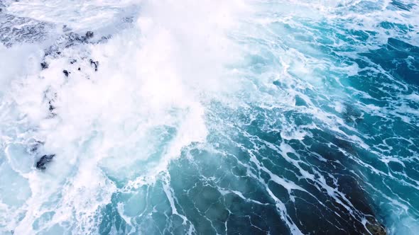 Ocean Waves Crash Against the Rocky Shore the Coastline of the Mediterranean Sea During a Storm