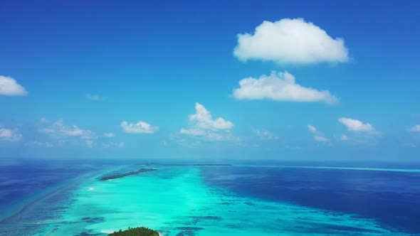 Aerial sky of perfect tourist beach vacation by blue green lagoon and white sandy background of adve