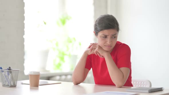 Tense Indian Woman Feeling Frustrated While Sitting in Office