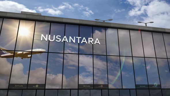 Airplane landing at Nusantara Indonesia airport mirrored in terminal