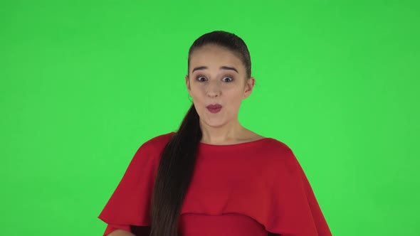 Portrait of Pretty Young Woman with Shocked Surprised Wow Face Expression. Green Screen